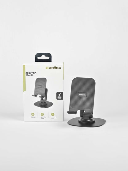 Black Schlüssel adjustable desktop phone stand displayed next to its product retail packaging box against a clean light gray background